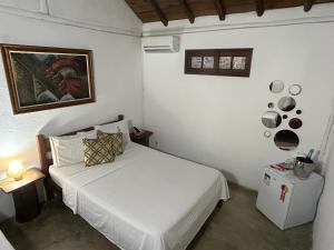 Postel nebo postele na pokoji v ubytování Hospedagem Estalagem Paraty para temporada