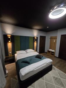 Postel nebo postele na pokoji v ubytování Hotel Yarus