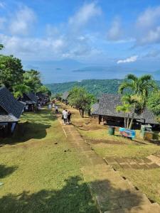 a group of people walking in a village at Wind Residences Tagaytay Tower 3 in Galicias