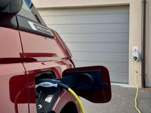 a car is hooked up to a hydrogen car charger at Apartments ALPsmart in Oetz +62 photos