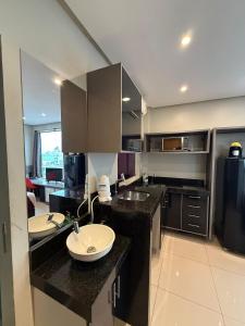 a kitchen with two sinks and a counter top at Studio Maraba-LOFT LINDO in Marabá +22 photos