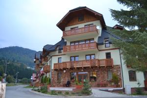 a large building with a gambrel roof at Apartment 7 Donovaly, AD Kamzík in Donovaly