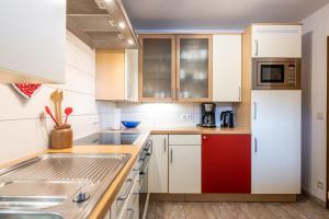 Kuchyň nebo kuchyňský kout v ubytování Das Ferienhaus Oberstdorf