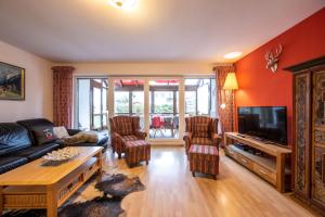 TV a/nebo společenská místnost v ubytování Das Ferienhaus Oberstdorf