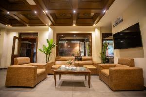 a living room with couches and a coffee table at Capital Boutique Hotel in Kathmandu