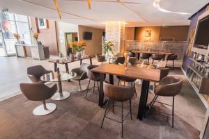 a restaurant with tables and chairs in a room at Sonesta Hotel Arequipa in Arequipa