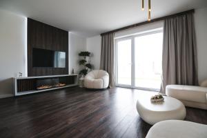 TV a/nebo společenská místnost v ubytování OLI Apartmán