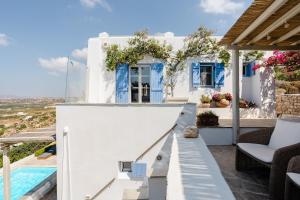 a villa with a swimming pool and a house at Agapui-Peaceful Retreat with Amazing Views in Naxos Chora