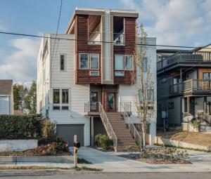 an apartment building with wooden balconies and stairs at Downtown 10 Beds Game Room Hot Tub Roof Deck in Nashville