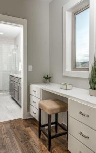 a white kitchen with a desk and a window at Downtown 10 Beds Game Room Hot Tub Roof Deck in Nashville