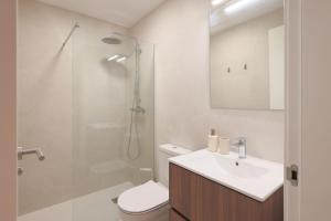 a bathroom with a toilet and a sink and a shower at Villa Almendro Santa Rosalia Lake and Life Resort by PREMIUM SPAIN PROPERTIES in Torre-Pacheco
