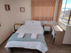Postel nebo postele na pokoji v ubytování MADA Guest House Puno "Hospedaje"