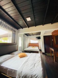 Postel nebo postele na pokoji v ubytování The Loversleap Resort Nuwara Eliya + 24 fotografií