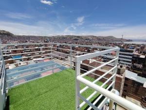 a balcony with a swimming pool on top of a building at MADA GUEST HOUSE Hs in Puno