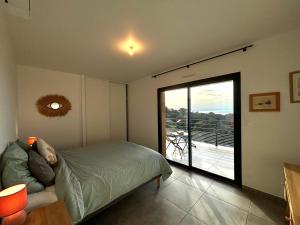 Ένα ή περισσότερα κρεβάτια σε δωμάτιο στο Duplex Tour d'Omigna Cargèse