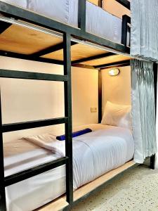Ένα ή περισσότερα κρεβάτια σε δωμάτιο στο Jancoox Hostel