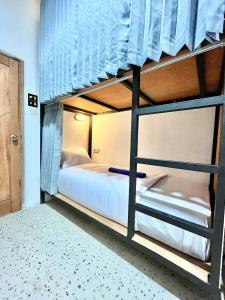 Ένα ή περισσότερα κρεβάτια σε δωμάτιο στο Jancoox Hostel