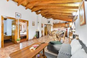 a living room with a couch and a table at Villa Serena with pool in Budak