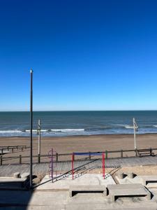 a beach with the ocean in the background at Departamento frente al mar 1 B in Monte Hermoso