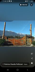 a screenshot of a picture of a wooden fence at Cabañas SurEnya in El Bolsón +37 photos