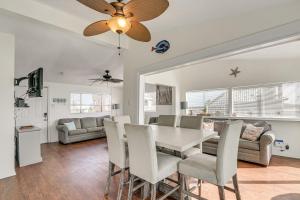 a dining room and living room with a table and chairs at Oceanfront Galveston Home on Terramar Beach in Galveston