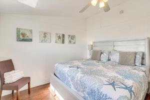 a bedroom with a bed and a ceiling fan at Oceanfront Galveston Home on Terramar Beach in Galveston