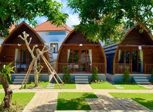 a house with a playground in front of it at Ungasan Center Hostel in Jimbaran