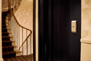 a close up of a door with a staircase at 6 VH Hotel in Paris
