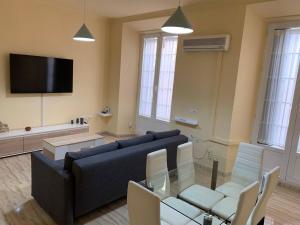 Televízia a/alebo spoločenská miestnosť v ubytovaní Apartamento Marín García C - Centro Histórico
