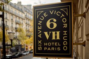 a sign for a hotel on the side of a building at 6 VH Hotel in Paris