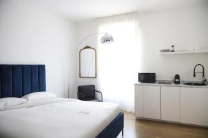 Postel nebo postele na pokoji v ubytování Isaia Milano