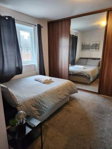 Ένα ή περισσότερα κρεβάτια σε δωμάτιο στο Heronsgate GH017