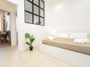 Postel nebo postele na pokoji v ubytování Valguarnera Studio Apartments