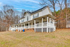 a large white house with a large yard at Spacious Mooresville Home with Lake Norman View! in Mooresville