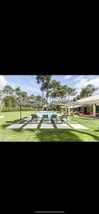 a park with picnic tables and a playground at Charming Villa Jarros Private pool & Golf in Aroeira