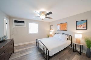 a bedroom with a bed and a ceiling fan at OV Mosaic - Topaz Suite in North Camellia Acres