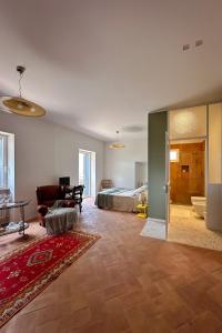 a large room with a bed and a living room at Merumalia Wine Resort in Frascati +77 photos