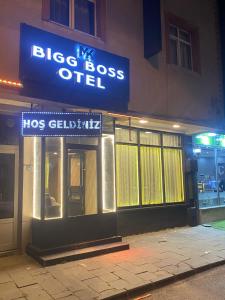 a building with a sign for a big boss office at Mk Bigg Boss Otel in Erzurum