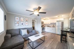 a living room with a couch and a ceiling fan at OV Mosaic - Golden Suite in North Camellia Acres