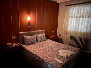 a bedroom with a bed and a window at Mk Bigg Boss Otel in Erzurum +6 photos