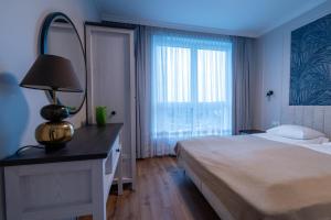 Posteľ alebo postele v izbe v ubytovaní LTC - Apartments Świętego Piotra