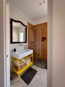 a bathroom with a sink and a mirror and a shower at Merumalia Wine Resort in Frascati +77 photos