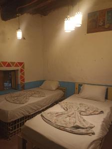 Postel nebo postele na pokoji v ubytování Bait Ward Nubian House + 3 fotografie