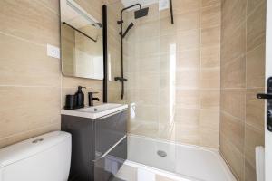 Ванная комната в Appartement proche Paris Porte de Versailles - II