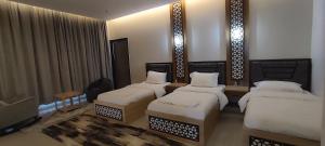 Uma cama ou camas num quarto em استراحة دهجان Dehjan chalet