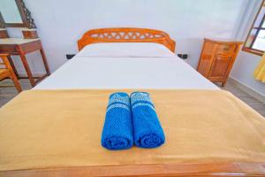 Postel nebo postele na pokoji v ubytování Uns Hotel - Bali