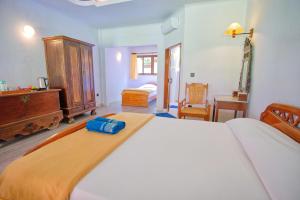 Postel nebo postele na pokoji v ubytování Uns Hotel - Bali