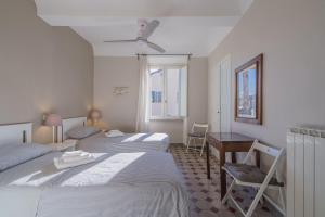 Voodi või voodid majutusasutuse TERRAZZA COCCODE' spazioso con vista mozzafiato! toas
