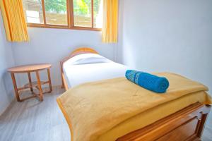 Postel nebo postele na pokoji v ubytování Uns Hotel - Bali