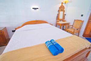 Postel nebo postele na pokoji v ubytování Uns Hotel - Bali